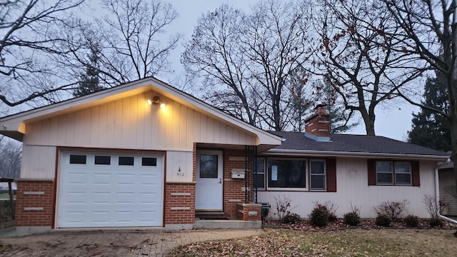 single story home featuring a garage