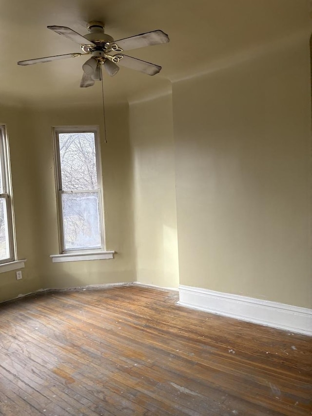 unfurnished room featuring hardwood / wood-style flooring and ceiling fan