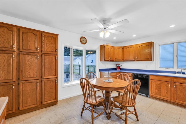 dining area with light tile patterned flooring, ceiling fan, and sink