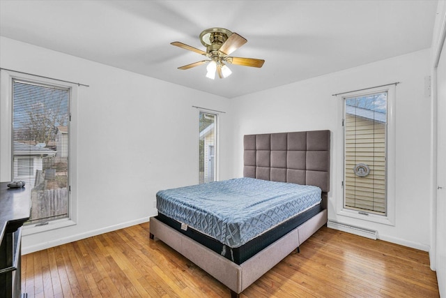 bedroom featuring ceiling fan and hardwood / wood-style flooring