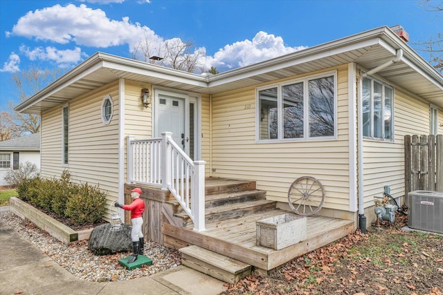 doorway to property featuring cooling unit