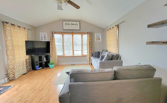 living room with wood-type flooring, ceiling fan, and lofted ceiling