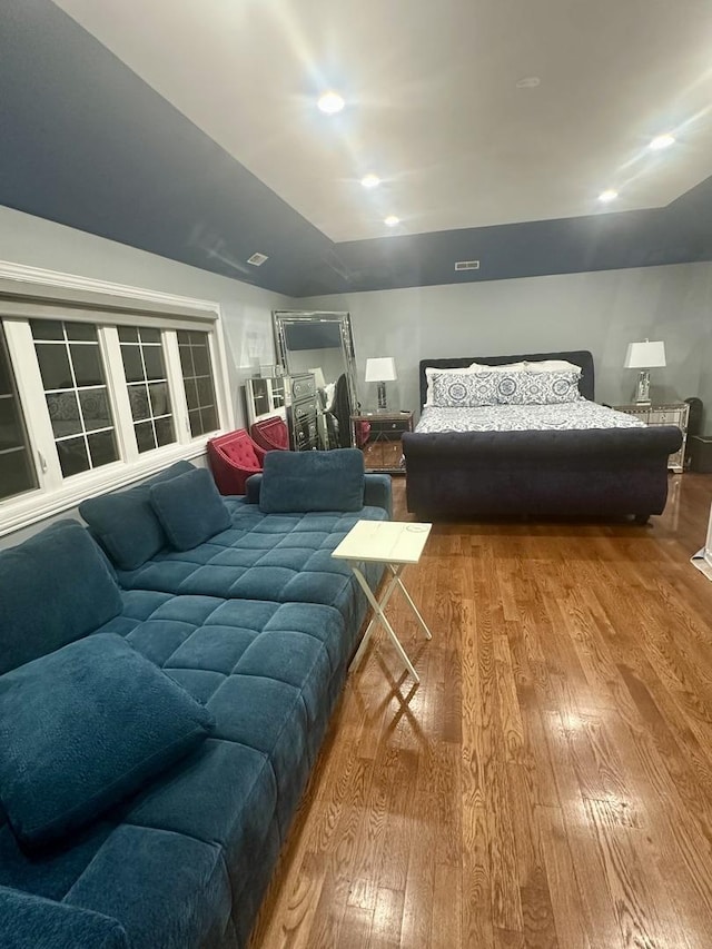 bedroom with hardwood / wood-style flooring