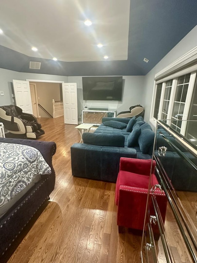 bedroom with hardwood / wood-style floors