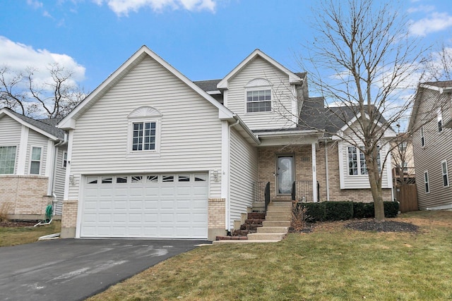 front facade featuring a front yard and a garage