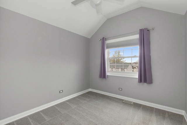 unfurnished room with ceiling fan, carpet, and vaulted ceiling