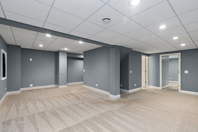 basement featuring light colored carpet