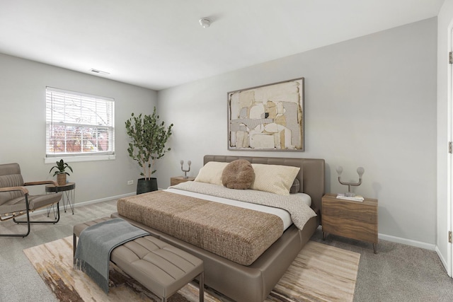 bedroom with light colored carpet