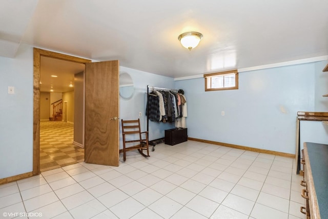 interior space with stairway and baseboards