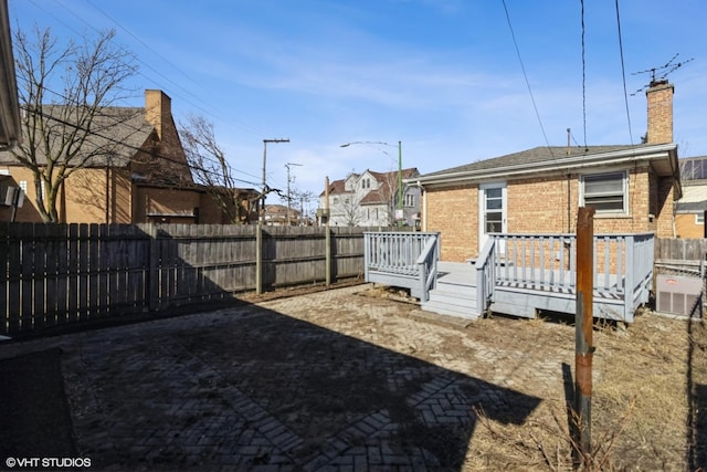 view of yard featuring a deck and fence private yard