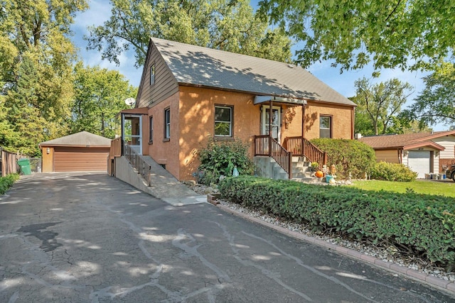 view of front of house featuring an outbuilding and a garage