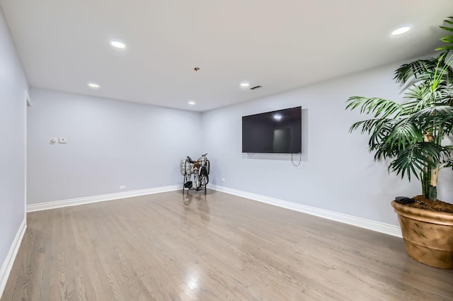 unfurnished living room featuring hardwood / wood-style floors