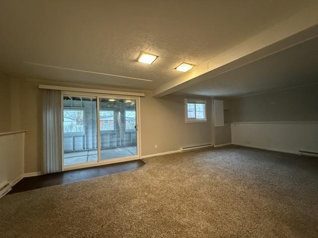 interior space featuring carpet, a textured ceiling, and a baseboard radiator