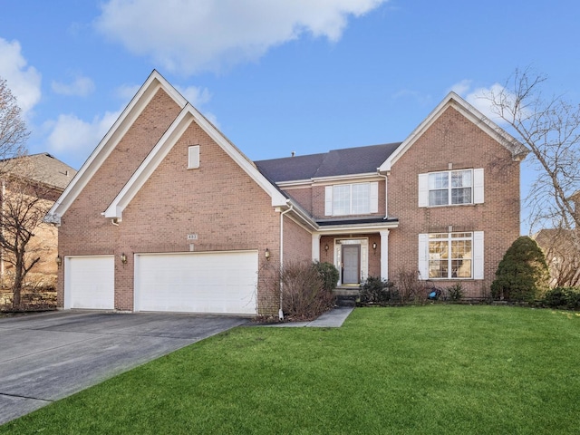 front facade with a front yard and a garage