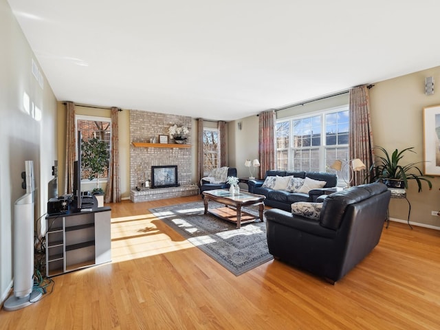 living room with a fireplace and hardwood / wood-style flooring