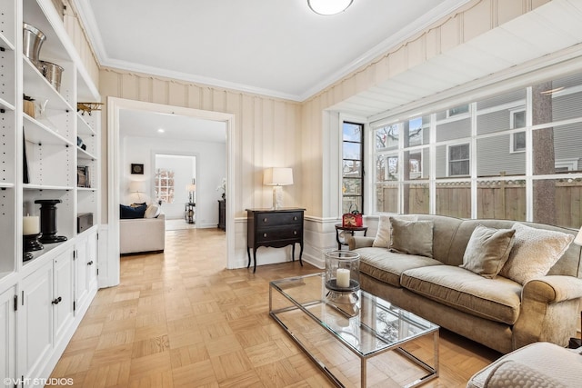 living room featuring crown molding and light parquet floors