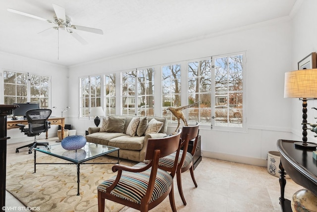 sunroom / solarium featuring ceiling fan