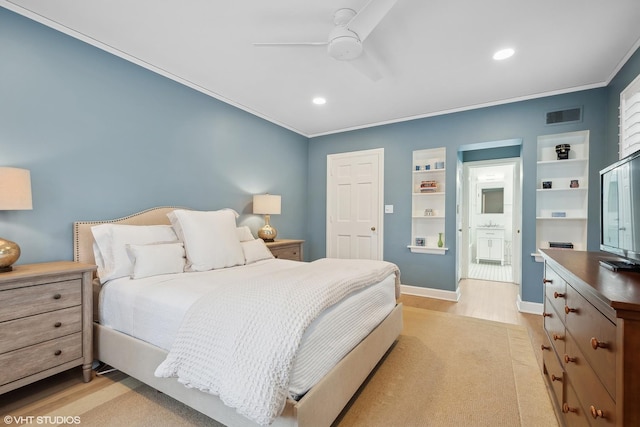 bedroom featuring ensuite bath, ornamental molding, light hardwood / wood-style floors, and ceiling fan