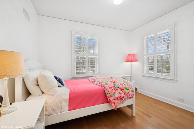 bedroom featuring hardwood / wood-style flooring