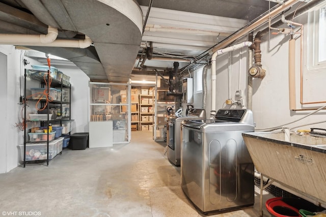 basement featuring sink and washing machine and clothes dryer