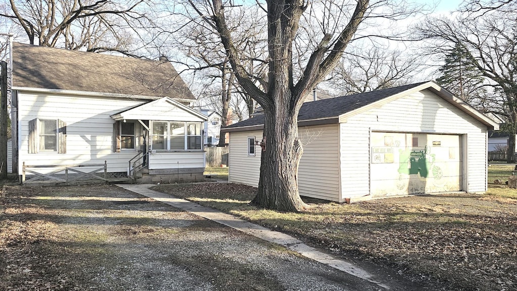 exterior space with an outdoor structure and a garage