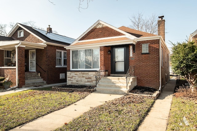 view of front of home featuring solar panels