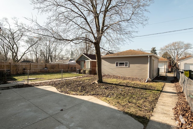 view of property exterior featuring a yard, an outdoor structure, and a patio