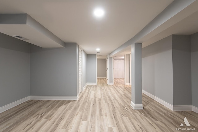 basement featuring light hardwood / wood-style floors