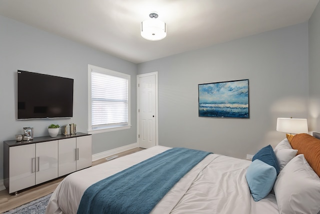 bedroom with light hardwood / wood-style flooring