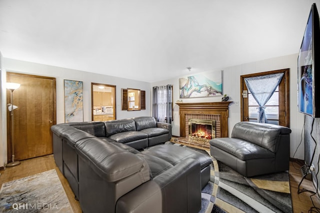 living room with a fireplace and light hardwood / wood-style flooring