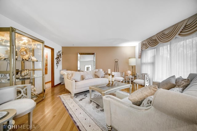 living room featuring light hardwood / wood-style flooring and a healthy amount of sunlight