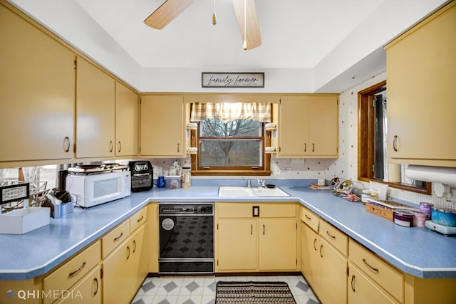 kitchen with ceiling fan, light brown cabinets, sink, and black dishwasher