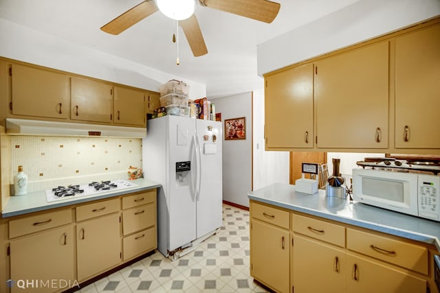 kitchen featuring decorative backsplash, ceiling fan, and white appliances