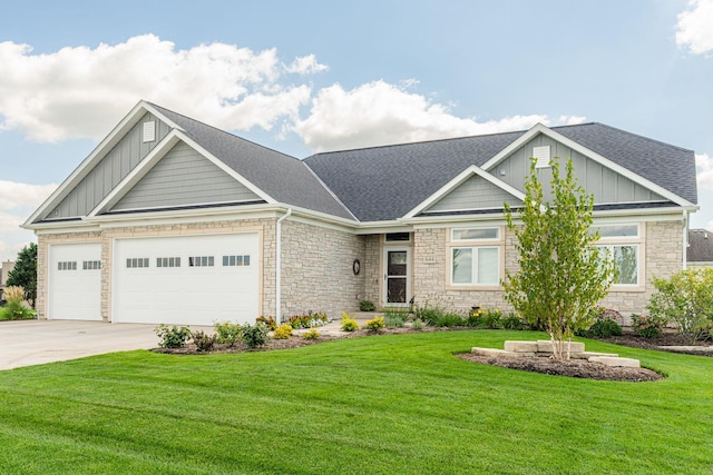 craftsman-style home featuring a front lawn and a garage