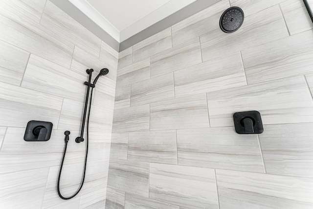 bathroom with tiled shower