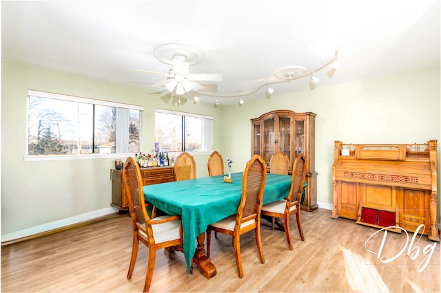 dining room featuring light wood-type flooring and ceiling fan