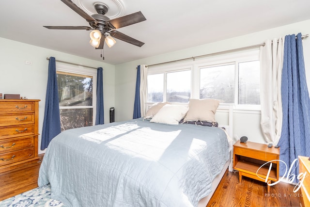 bedroom featuring ceiling fan and light hardwood / wood-style flooring