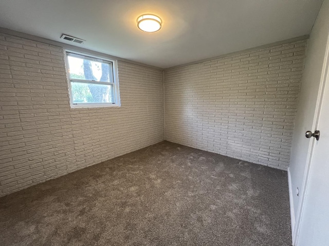 empty room featuring dark colored carpet