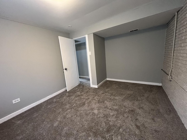 unfurnished bedroom featuring dark colored carpet