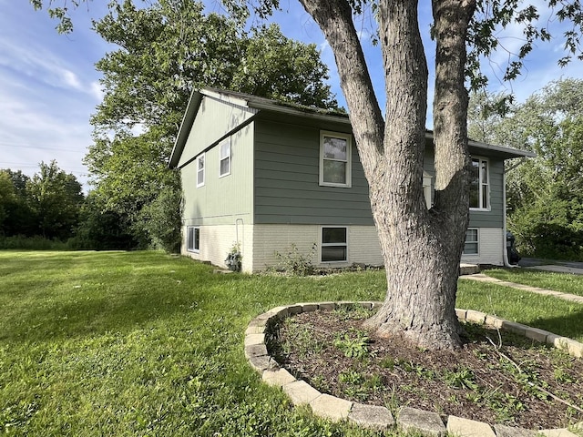 view of property exterior featuring a yard