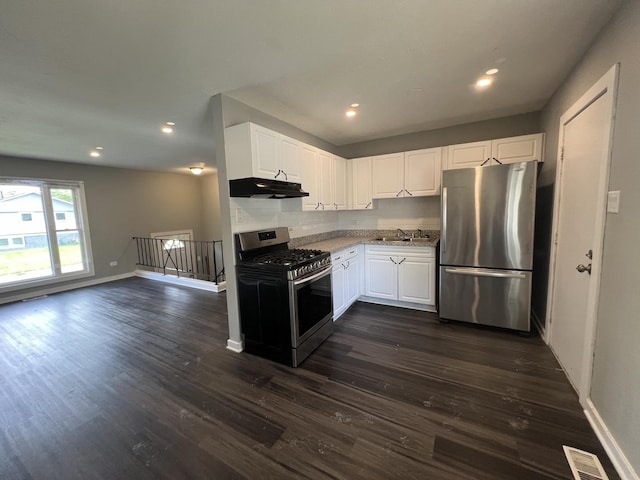 kitchen with white cabinets, stainless steel appliances, dark hardwood / wood-style floors, and sink