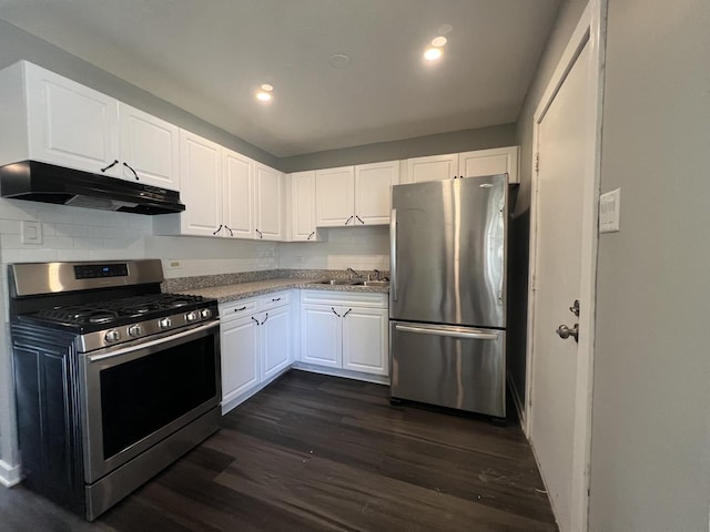 kitchen with dark hardwood / wood-style floors, white cabinetry, sink, and appliances with stainless steel finishes