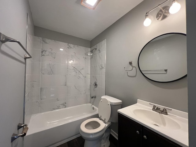 full bathroom featuring toilet, vanity, and washtub / shower combination