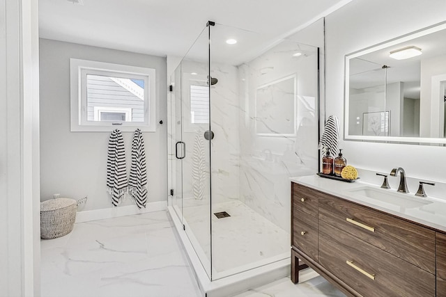 bathroom featuring an enclosed shower and vanity