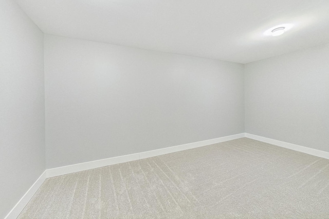 unfurnished room featuring carpet