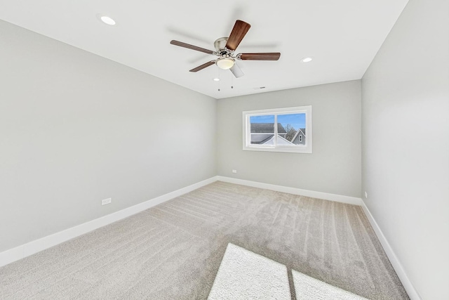 carpeted empty room with ceiling fan