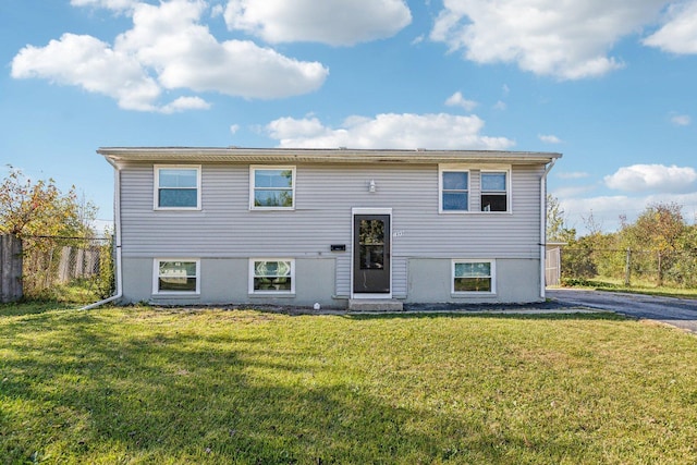 raised ranch with a front lawn