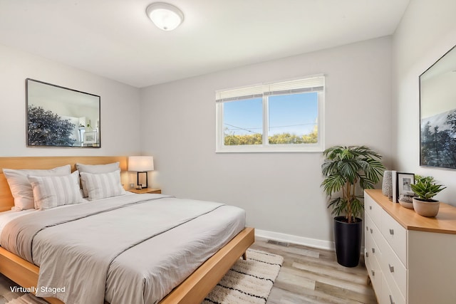 bedroom with light hardwood / wood-style floors