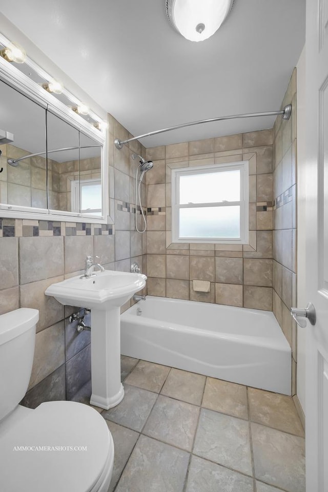 1607 Warwick Ln, Schaumburg, IL 60193 - bathroom with toilet, shower / bath combination, and tile walls