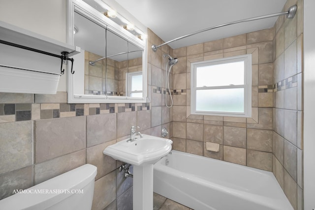 1607 Warwick Ln, Schaumburg, IL 60193 - full bathroom featuring bathtub / shower combination, toilet, tile walls, and backsplash
